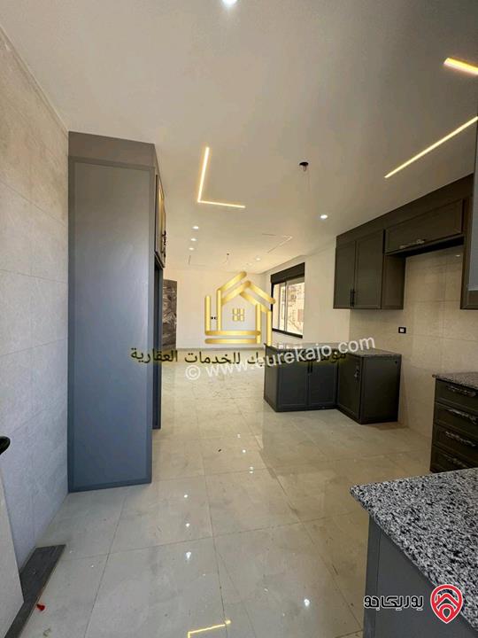 شقة جديدة لم تسكن طابق ارضي مساحة 125م للإيجار في عمان - مرج الحمام 