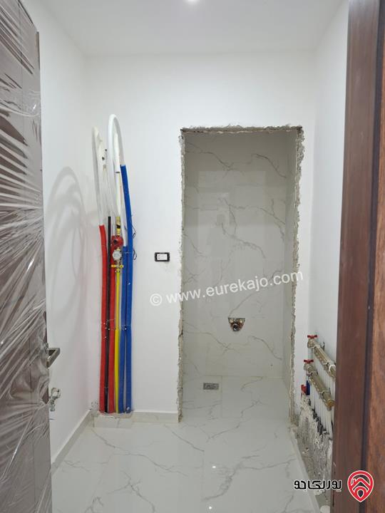 شقة جديدة طابق أول مساحة 170م للبيع في عمان - الرابية