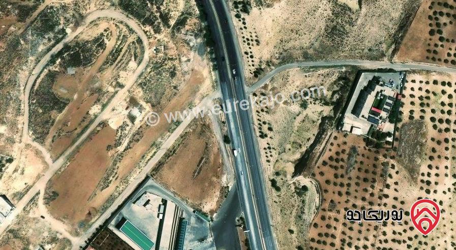 أرض مساحة 13 دونم و 657م للبيع من أراضي شمال عمان - موبص على شارع الأردن مباشرة