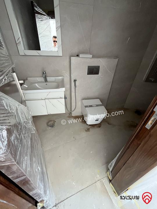 شقة طابق أول مساحة 100م للبيع في عمان - جبل الزهور