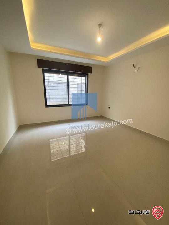 شقة شبه ارضية مساحة 175م مع ترسات 120م للبيع في عمان - الرابية