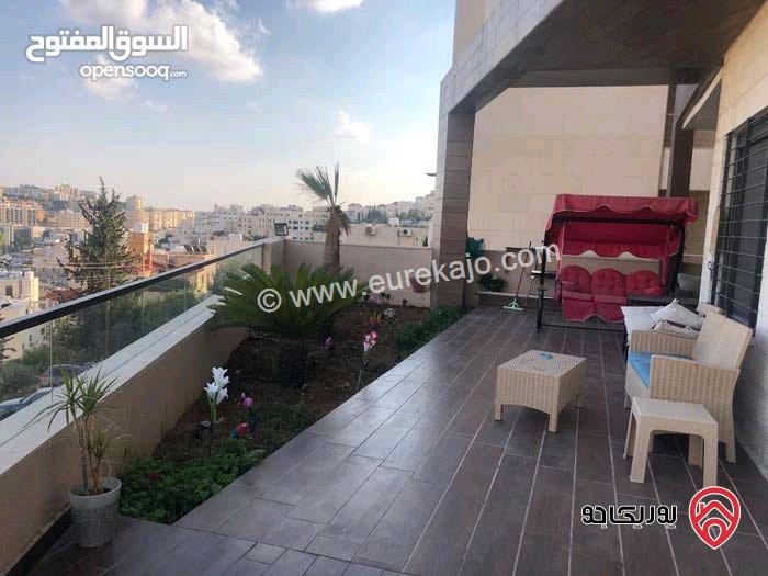 شقة طابقية ارضي معلق مساحة 226م داخلي و 180م خارجي بأطلالة للبيع في عمان - دابوق 