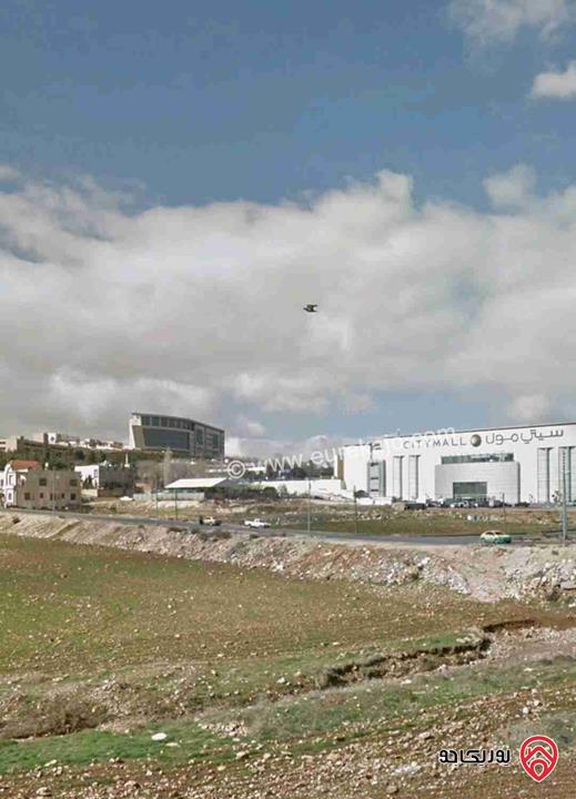 ارض تجاري مكاتب مساحة 5 دونم للبيع في عمان - أم السماق قرب السيتي مول تصلح لمشاريع استثمارية 