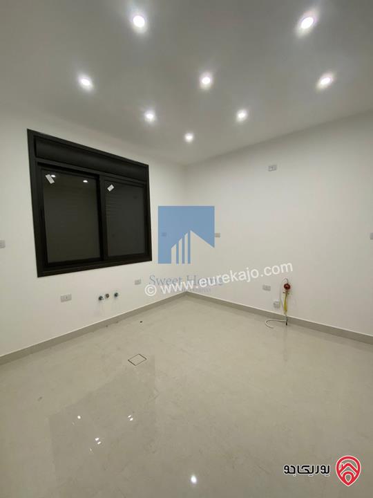 شقة أرضية فاخرة للبيع في عمان - الجندويل قرب المتصرفية 170م مع ترس 50م لم تسكن بسعر مغري