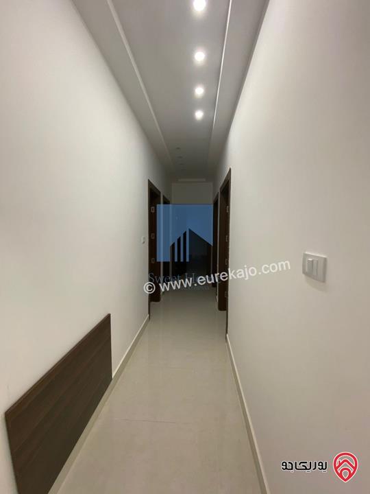 شقة أرضية فاخرة للبيع في عمان - الجندويل قرب المتصرفية 170م مع ترس 50م لم تسكن بسعر مغري