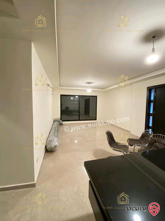 شقة جديدة لم تسكن طابق ارضي مساحة 200م مع ترس 40م للإيجار في عمان - خلدا 