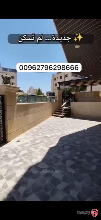 شقة فاخرة أرضية للبيع بسعر مغري في عمان - طريق المطار مساحة 183م + 130م وكراج مستقل وثلاث مداخل ماشاءالله