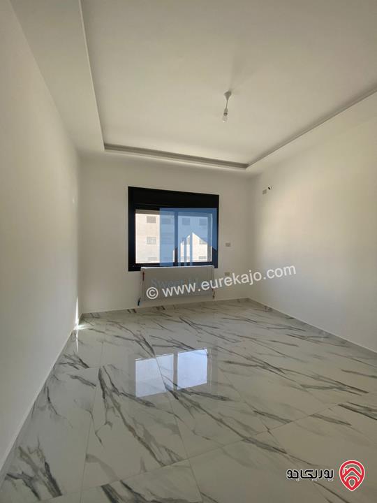 شقة أرضية فاخرة مساحة 200م مع ترس 10م لم تسكن للبيع في عمان - تلاع العلي