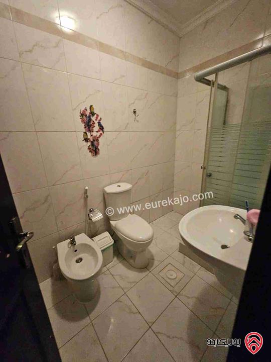 شقه طابق ارضي مساحة 150م مع حديقة 100م للبيع في عمان - الرابية 