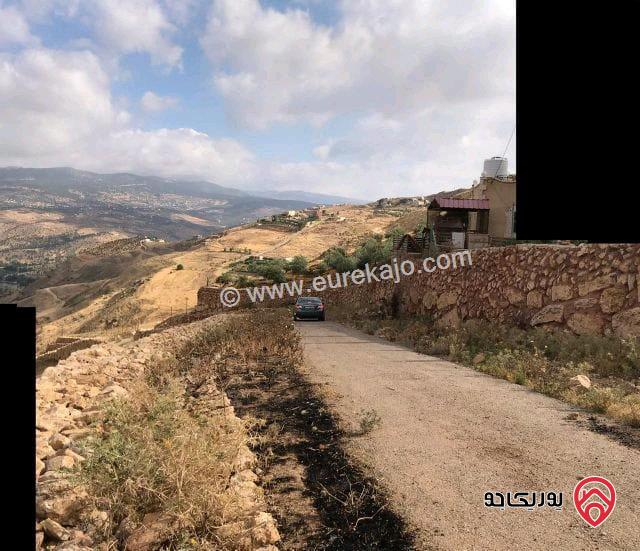 قطعة أرض مميزة ومطلة مساحة 12 دونم و 344م للبيع من أراضي شمال عمان - شارع الأردن على سد الملك طلال