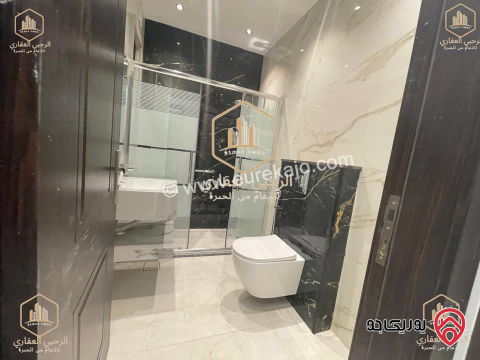 شقة ارضية مساحة 145م مع ترس خارجي 135م للايجار في عمان - الجندويل