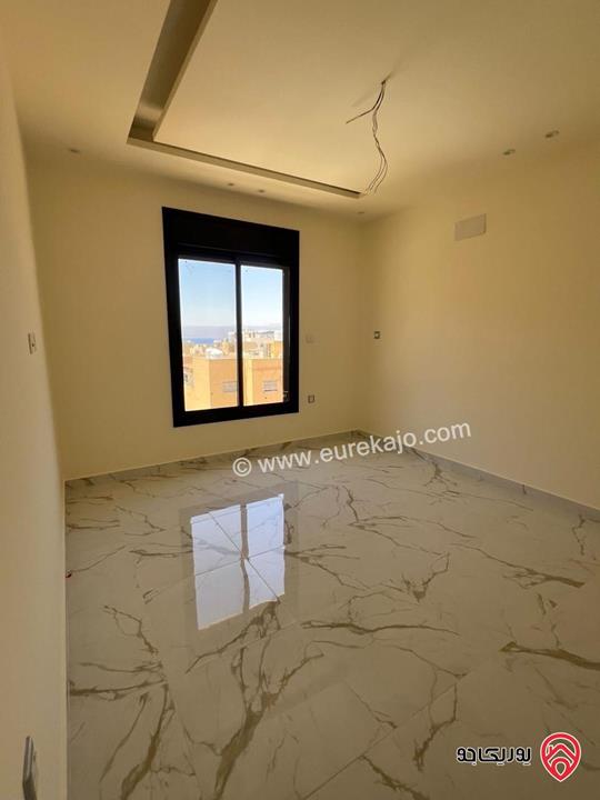 شقة طابق رووف مساحة 143م للبيع في العقبة - التاسعة