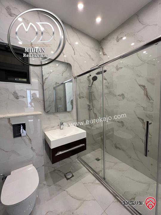 شقة ارضية جديدة للبيع في عمان - ضاحية النخيل مساحة 185م مع ترس 50م تشطيبات ديكورات فاخرة بسعر مميز