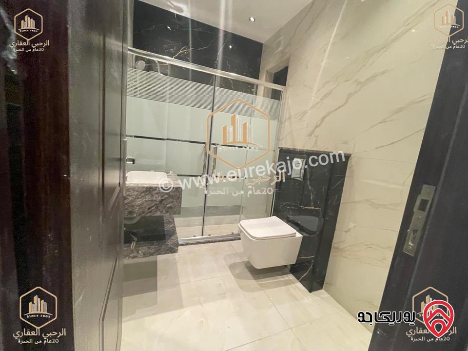 شقة ارضية مساحة 145م مع ترس خارجي 135م للايجار في عمان - الجندويل