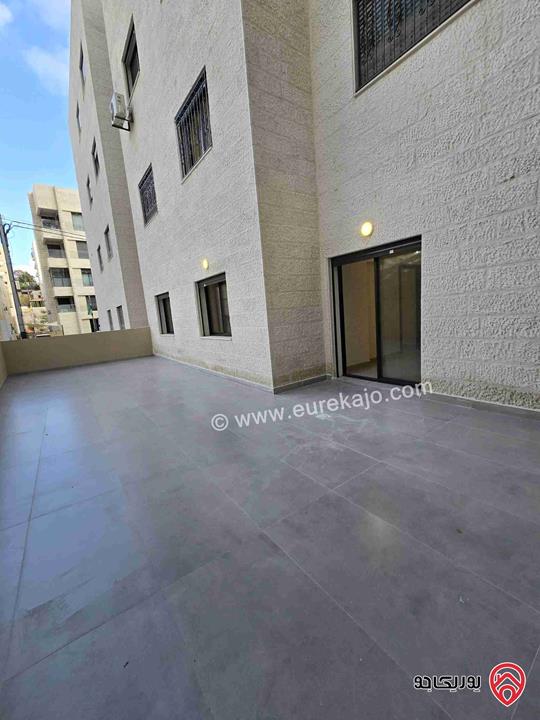 شقة أرضية مساحة 115م مع تراسات 90م للبيع في عمان - تلاع العلي