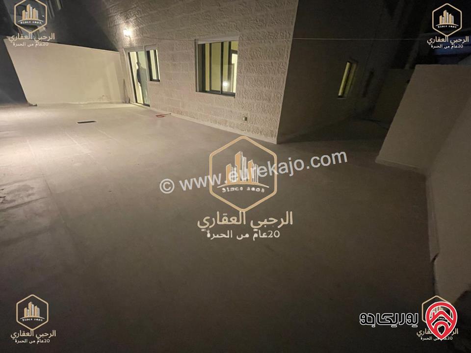 شقة ديلوكس شبه ارضية مساحة 90م مع ترس 50م للايجار في عمان - الجندويل 