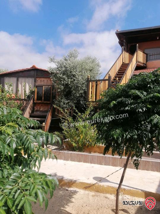 مزرعة ومنتجع مساحة الأرض 3 دونم و 700م والبناء 250م للبيع في اربد - كفر سوم قوشان مستقل استثمارية وسكنية