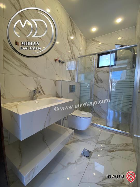 شقة دوبلكس ارضية للبيع في عمان - خلدا مساحة 315م مع ترس وحديقة 150م تشطيبات و ديكورات عصرية فاخرة جديدة لم تسكن