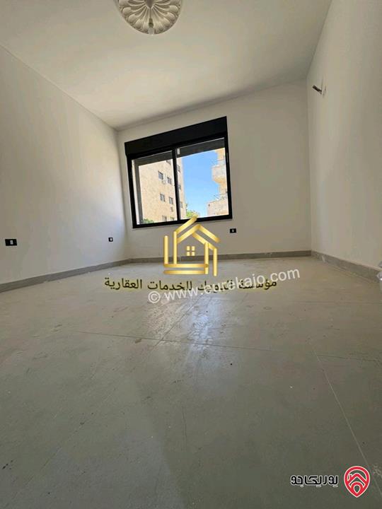 شقة جديدة لم تسكن طابق ارضي مساحة 125م للإيجار في عمان - مرج الحمام 