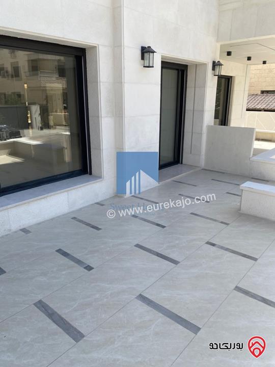 شقة أرضية فاخرة للبيع في عمان - أم أذينة قرب أبراج السادس 200م مع ترس 60م لم تسكن