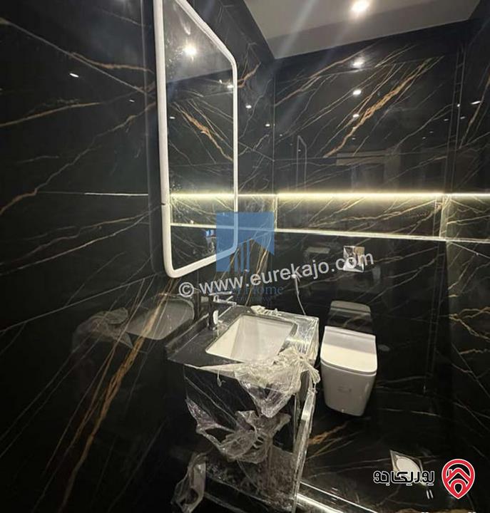 شقة أرضية فاخرة للبيع في عمان - تلاع العلي - خلف طواحين الهوا 180م مع ترس 40م لم تسكن