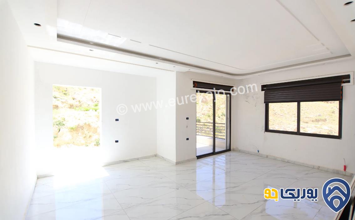 شقة مميزة للبيع في صويلح على حدود الجبيهة طابق تسوية 165م مع مدخل خاص واطلالة مميزة