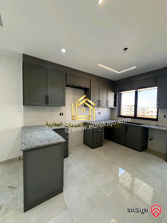 شقة جديدة لم تسكن طابق ارضي مساحة 125م للإيجار في عمان - مرج الحمام 