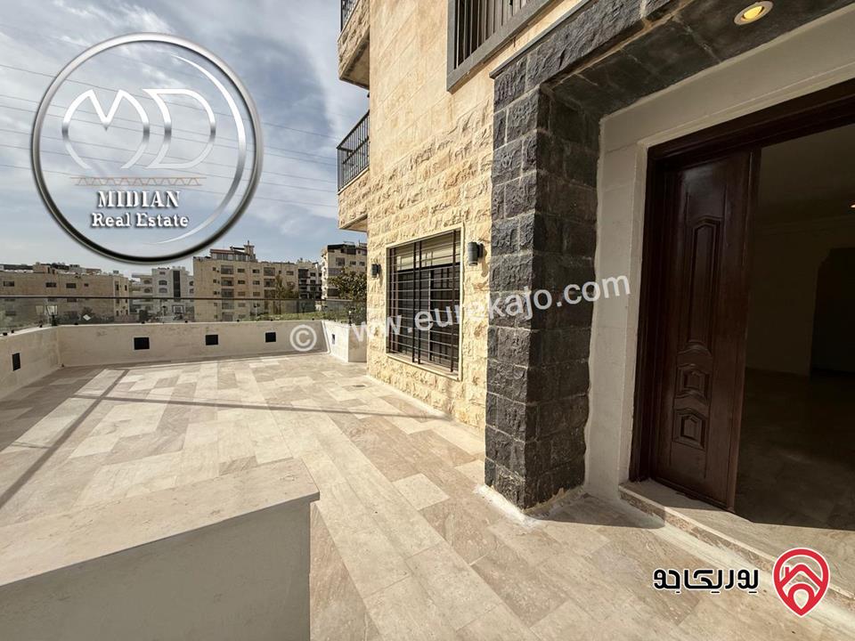 شقة ارضية للبيع في عمان - دير غبار مساحة 200م مع ترس 80م تشطيبات و ديكورات سوبر ديلوكس