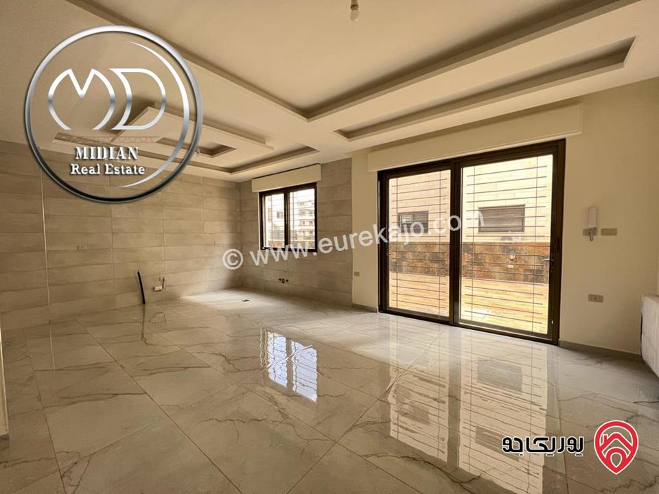 شقة أرضية جديدة للبيع في عمان - خلدا العوجانية مساحة 200م مع ترس و حديقة 150م تشطيبات ديكورات عصرية فاخرة بسعر مميز