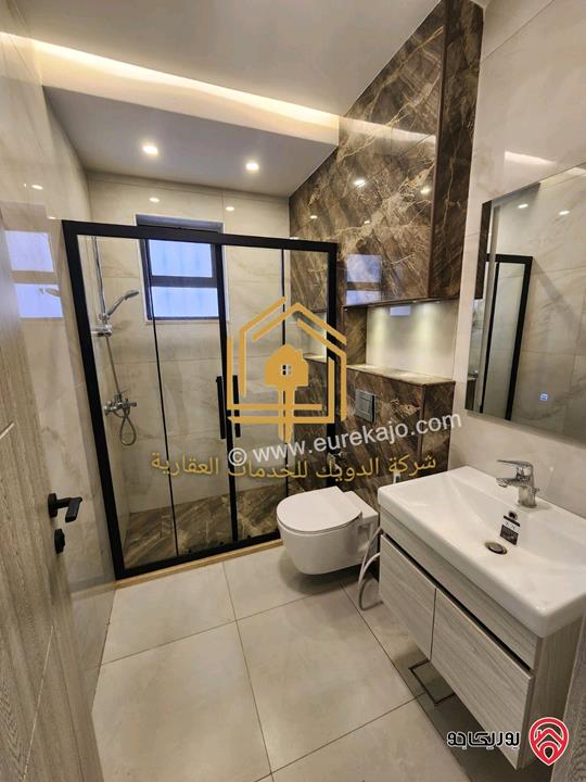 شقة جديدة لم تسكن طابق ارضي مساحة 110م مع ترس 50م للإيجار في عمان - ضاحية الرشيد 