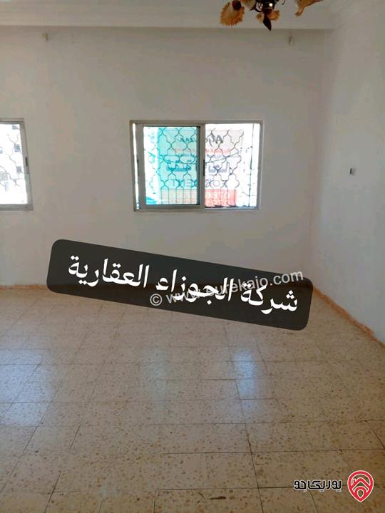 شقة فارغة مساحة 100م طابق ثاني للايجار في عمان - حي نزال شارع الدستور 
