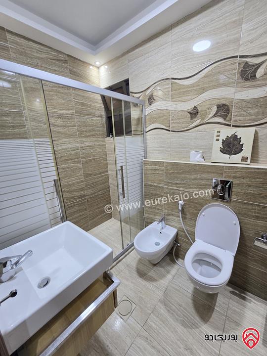 شقة ارضية مساحة 131م مع تراس 50م ومدخل خاص للبيع في عمان - الرابية 