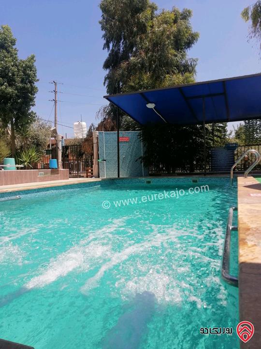 مزرعة ومنتجع مساحة الأرض 3 دونم و 700م والبناء 250م للبيع في اربد - كفر سوم قوشان مستقل استثمارية وسكنية