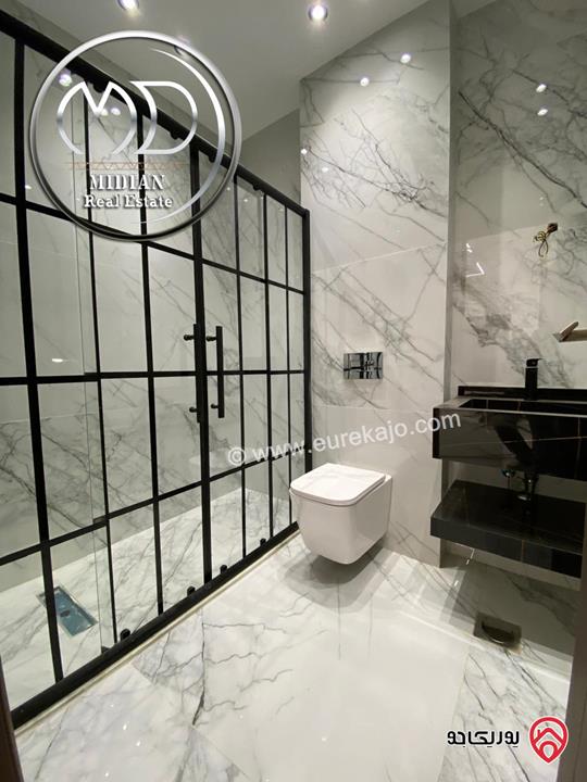 شقق شبه ارضي جديدة للبيع في عمان - الجاردنز مساحات 235م & 275م مع تراسات و حدائق تشطيبات ديكورات عصرية فاخرة