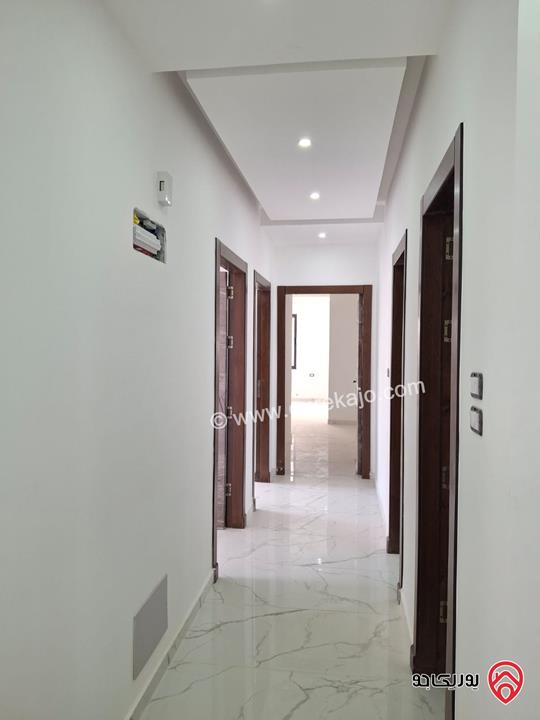 شقة جديدة طابق أول مساحة 170م للبيع في عمان - الرابية