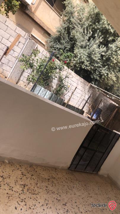 شقة أرضية مساحة 100م مدخلها مستقل للايجار في اربد قرب دوار سال الكبير شارع الهاشمي 