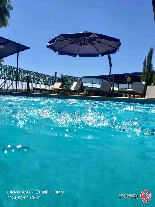 مزرعة ومنتجع مساحة الأرض 3 دونم و 700م والبناء 250م للبيع في اربد - كفر سوم قوشان مستقل استثمارية وسكنية