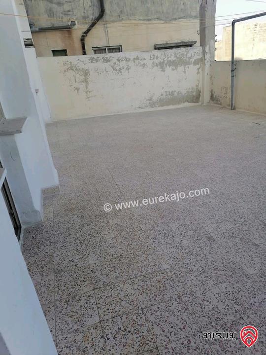 شقة شبه تسوية مساحة 110م داخلي و 42م خارجي للبيع في عمان - جبل التاج حي ام تينة 