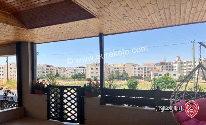 شقة ارضية مفروشة مساحة 200م داخلي و 100م خارجي للايجار في عمان - طريق المطار ضاحية النخيل 