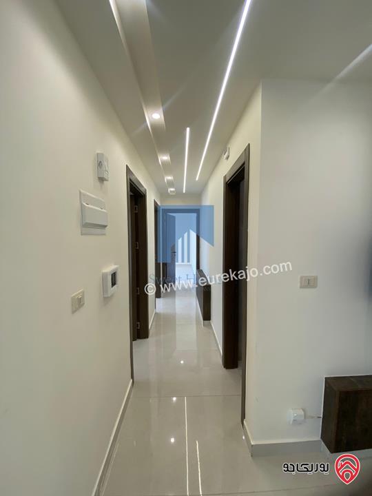 شقة أرضية فاخرة طابق ارضي معلق 90م تشطيب سوبر ديلوكس لم تسكن للبيع في عمان - أم أذينة