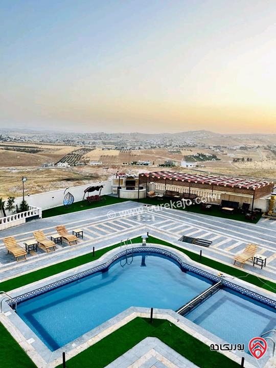 شاليه استثماري مميز مساحة الأرض 4 دونم و 500م والبناء 250م للبيع في المفرق - بلعما 