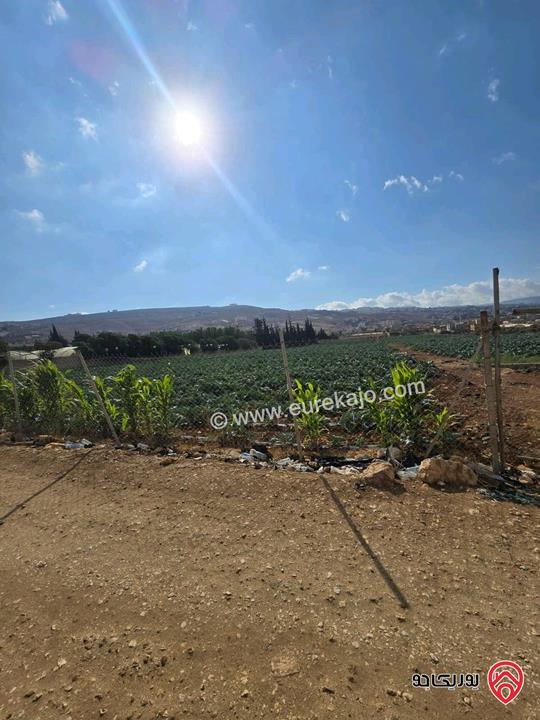 قطعة ارض ومشروع استثماري ناجح مساحة 24 دونم و 309م للبيع من اراضي شمال عمان - موبص تبعد عن شارع الاردن موقع قصر الجبل دقيقتين حوض سنينة الماء  