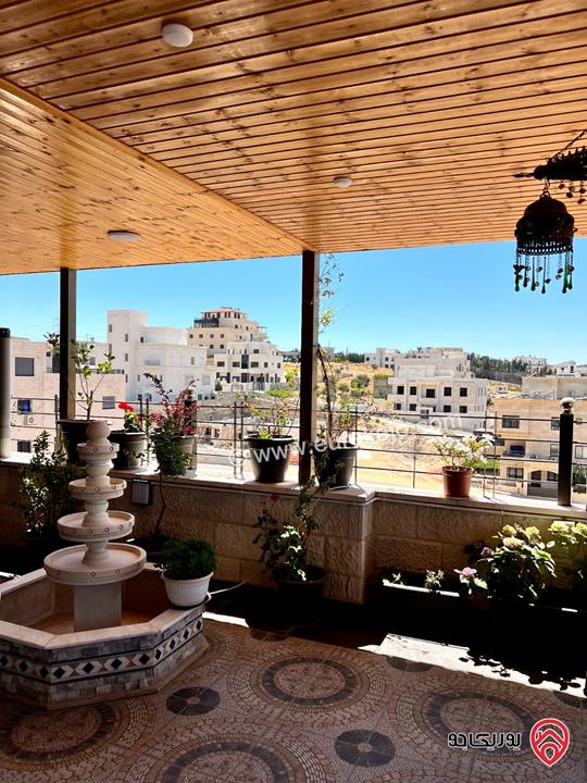 شقة طابق اخير مع روف 330م مع الترسات بمواصفات كاملة اطلالة بانوراما للبيع في عمان - طريق المطار بالقرب من جامعة البتراء