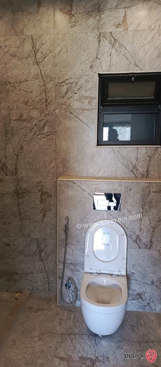 شقة جديدة طابق اول مساحة 150م للبيع في عمان - الجبيهة خلف حديقة الجبيهة