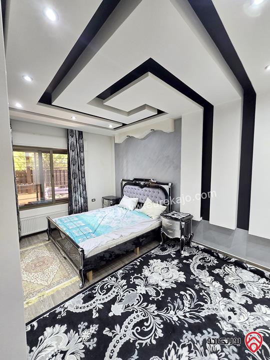 شقة ارضية مساحة 131م مع تراس 50م ومدخل خاص للبيع في عمان - الرابية 