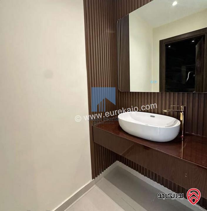 شقة أرضية فاخرة للبيع في عمان - تلاع العلي - خلف طواحين الهوا 180م مع ترس 40م لم تسكن