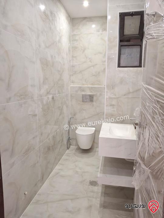 شقة جديدة طابق أول مساحة 170م للبيع في عمان - الرابية