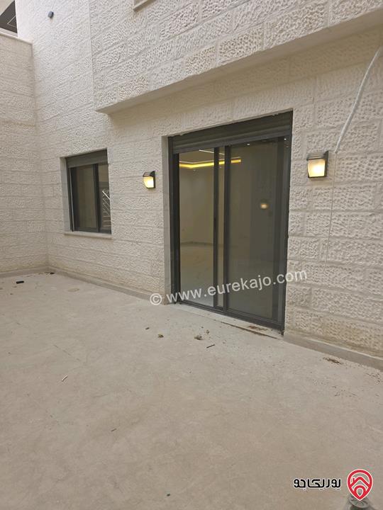 شقة شبه ارضي واسعة مساحة 185م داخلي وخارجي 220م ومشمسة تشطيبات ديلوكس للبيع في عمان - شفا بدران