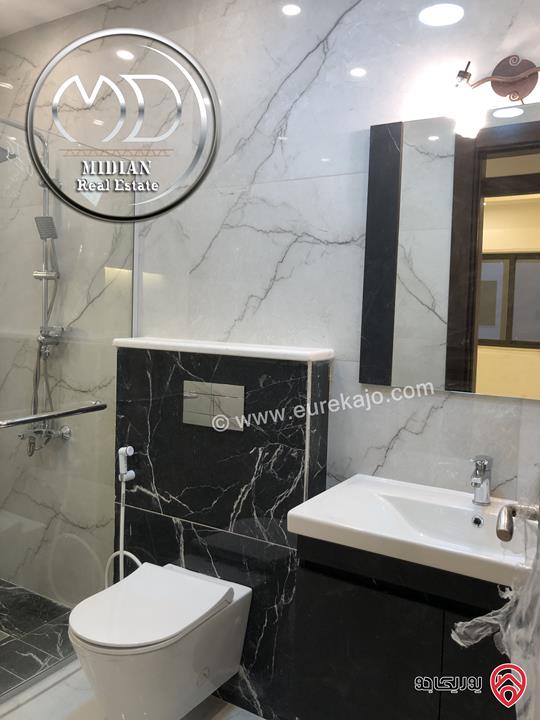 شقة شبه ارضي جديدة للبيع في عمان - ام السماق مساحة 200م مع ترس و حديقة 200م تشطيبات ديكورات سوبر ديلوكس بسعر مميز