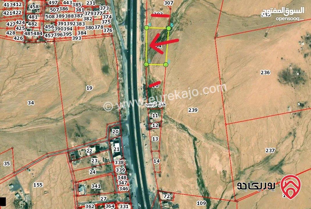 قطعة ارض مساحة 9 دونم و 329م للبيع من اراضي جنوب عمان - خان الزبيب واجهه 128م على الطريق الصحراوي موقع استثماري مميز يصلح لكافة الاستثمارات 